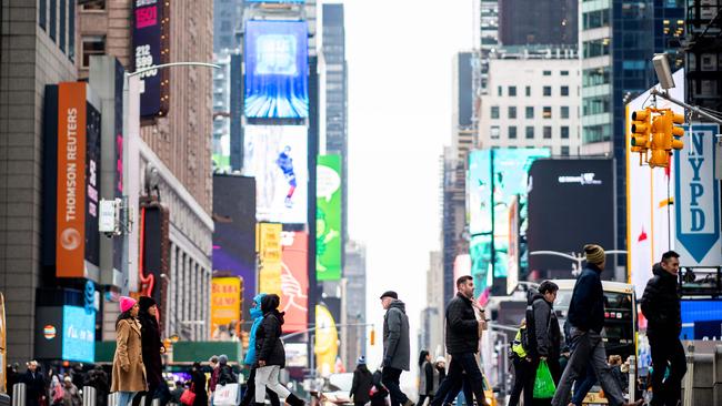 People walk across 42nd Street at Time Square in Manhattan. Picture: AFP.