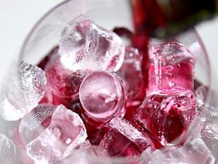  Glass of chilled red wine over ice. 