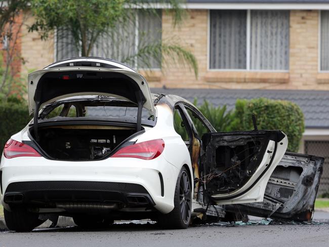 A burnt-out Mercedes car that was found shortly after a shooting in Bankstown. Picture Craig Greenhill