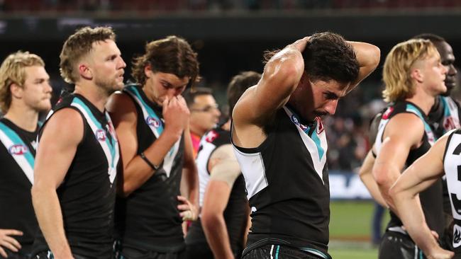 Power players react to the loss. (Photo by Sarah Reed/AFL Photos via Getty Images)