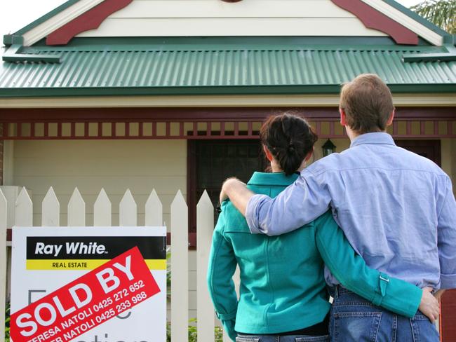 Generic pic of a couple looking at homes that are for sale.