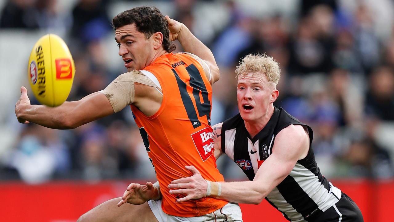 MELBOURNE, AUSTRALIA - JUNE 26: Tim Taranto of the Giants and John Noble of the Magpies in action during the 2022 AFL Round 15 match between the Collingwood Magpies and the GWS Giants at the Melbourne Cricket Ground on June 26, 2022 in Melbourne Australia. (Photo by Michael Willson/AFL Photos via Getty Images)