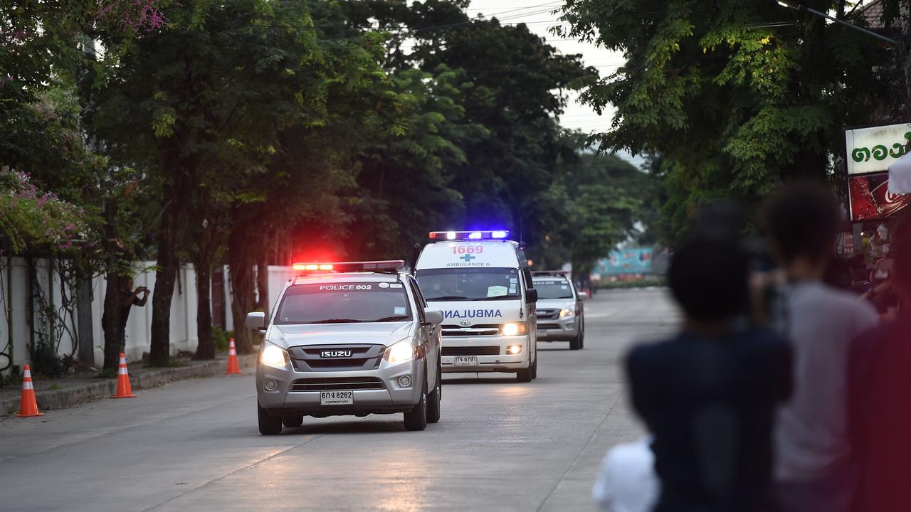 An ambulance transporting members of the soccer team approaches the hospital in the northern Thai city of Chiang Rai. Picture: AFP Photo / Lillian Suwanrumpha