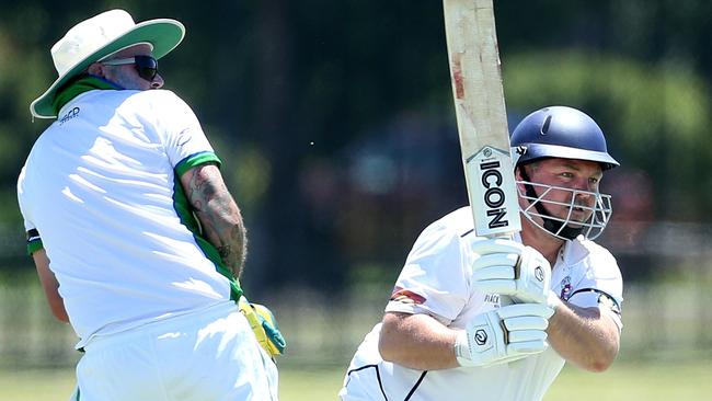 Lindon Dowsett hooks the ball away for Diggers Rest Bulla. Picture: Hamish Blair