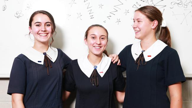 Iris Peters, Ashley Edwards and Jess Hulme, all 16, from St Aidan's Anglican Girls School. It is the only westside secondary school to score a perfect 100. Picture: AAP/Claudia Baxter