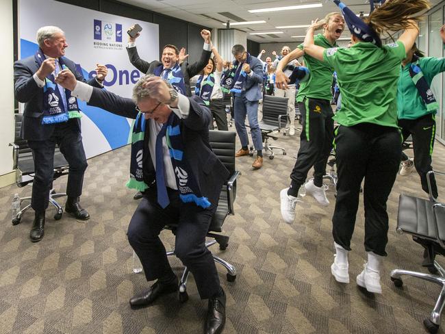 SYDNEY, AUSTRALIA - JUNE 26: Chris Nikou, Chairman of Football Federation Australia (C) along with officials and players react as FIFA announced Australia as the hosts to the 2023 FIFA Women's World Cup at the FFA Offices on June 26, 2020 in Sydney, Australia. (Photo by Jenny Evans/Getty Images) *** BESTPIX ***