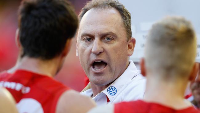 John Longmire speaks to his players during the win over St Kilda.