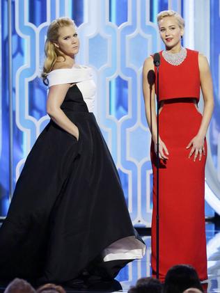 BEVERLY HILLS, CA - JANUARY 10: In this handout photo provided by NBCUniversal, Presenters Amy Schumer and Jennifer Lawrence speak onstage during the 73rd Annual Golden Globe Awards at The Beverly Hilton Hotel on January 10, 2016 in Beverly Hills, California. (Photo by Paul Drinkwater/NBCUniversal via Getty Images)
