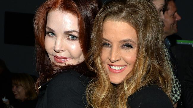 Priscilla Presley celebrates backstage with her daughter Lisa Marie Presley after Lisa Marie's performance at the Americana Music Festival &amp; Conference in 2013. Picture: Rick Diamond/Getty Images for Americana Music Festival