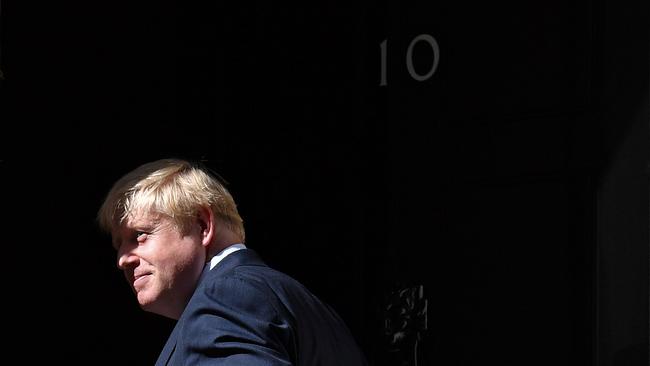 Britain's Prime Minister Boris Johnson turns to enter no 10 after giving a speech outside 10 Downing Street in London.