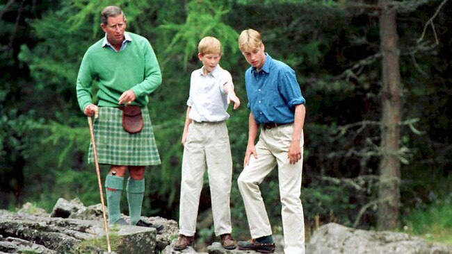 The Prince of Wales and sons Prince William (right) and Prince Harry, above the Falls of Muick on the Balmoral Estate during a summer break in August 1997. Picture: Fiona Hanson/AFP