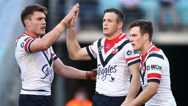 Brett Morris celebrates with teammates after scoring a try for the Roosters. Picture: AAP