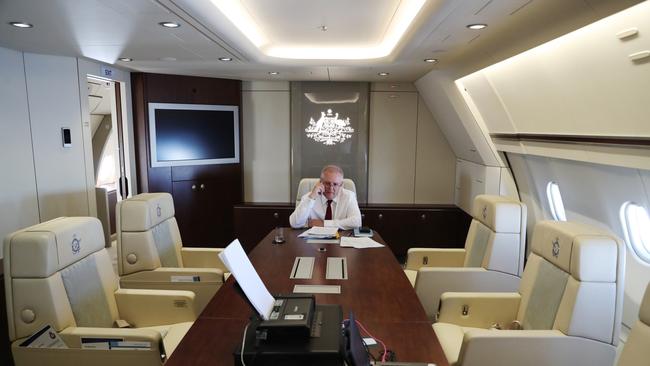 Scott Morrison takes a phone call inside ‘Shark One’, his $250m converted VIP plane.