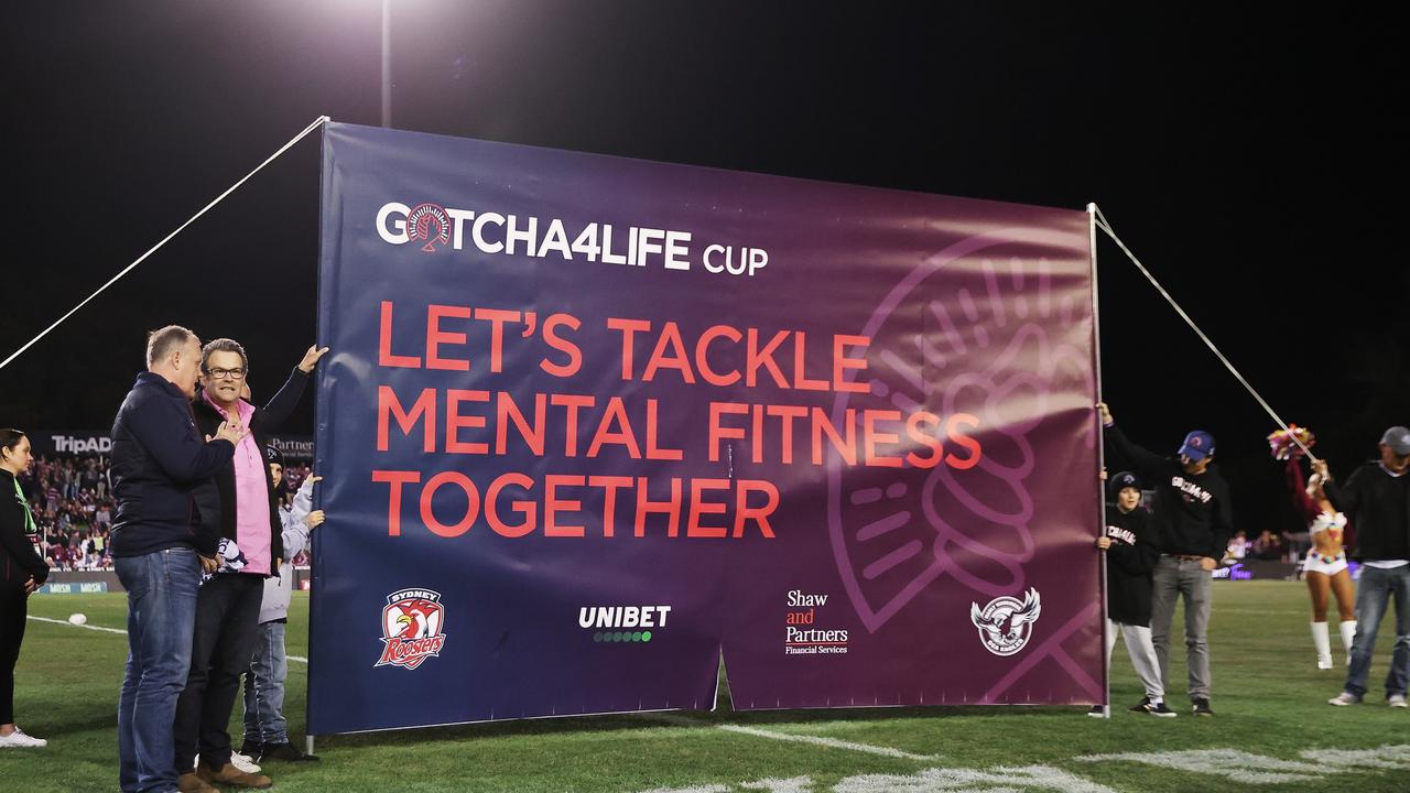 Worland holds up a banner before the round 20 NRL match between the Manly Sea Eagles and the Sydney Roosters at 4 Pines Park on July 28, 2022. Picture: Cameron Spencer/Getty Images