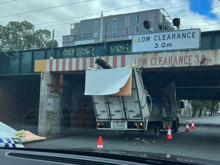 A truck was torn to shreds after colliding with the bridge on Friday