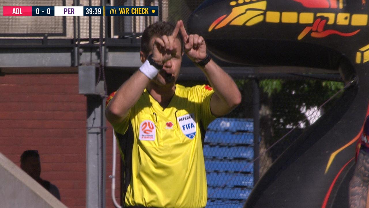 Chris Beath signals for the VAR.