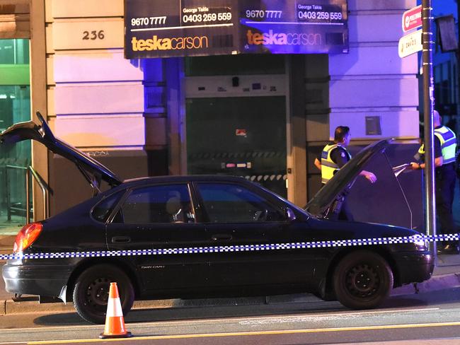 Police collecting evidence on Chapel St. Picture: Nicole Garmston