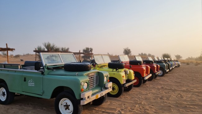 Tourists can explore the dunes in beautifully restored vintage Land Rovers. Picture: Kirrily Schwarz