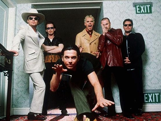 INXS in 1997 from left, Tim Farriss, Kirk Pengilly, Michael Hutchence, foreground, Jon Farriss, Garry Gary Beers and Andrew Farriss. INXS