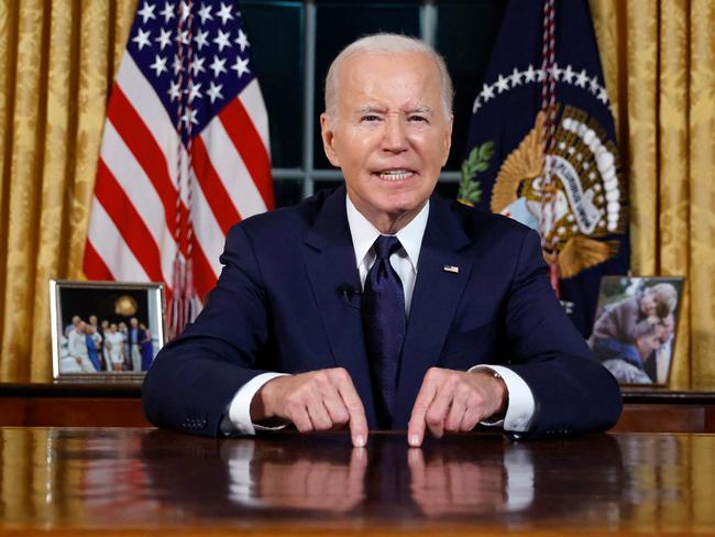 TOPSHOT - US President Joe Biden addresses the nation on the conflict between Israel and Gaza and the Russian invasion of Ukraine from the Oval Office of the White House in Washington, DC, on October 19, 2023. President Joe Biden will deliver a rare Oval Office speech October 19, 2023 urging Americans to back military aid for Israel and Ukraine at what he calls a perilous moment for democracy around the globe. (Photo by JONATHAN ERNST / POOL / AFP)