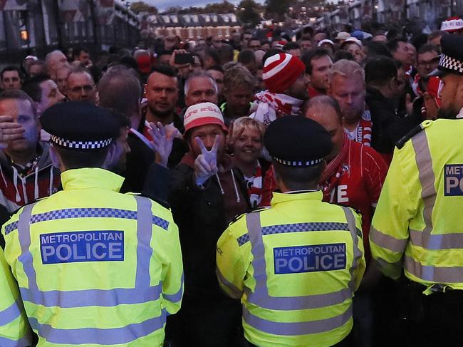 Police forces block Cologne supporters outside the Emirates stadium prior to the Europa League group H soccer match between Arsenal and FC Cologne at the Emirates stadium in London, England, Thursday, Sept. 14, 2017 . (AP Photo/Kirsty Wigglesworth)