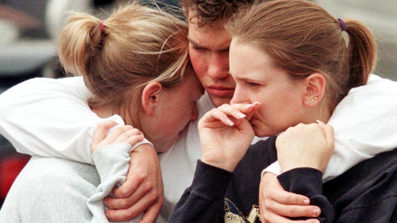 Columbine students support each other following the shooting. Picture Mark Leffingwell / AFP