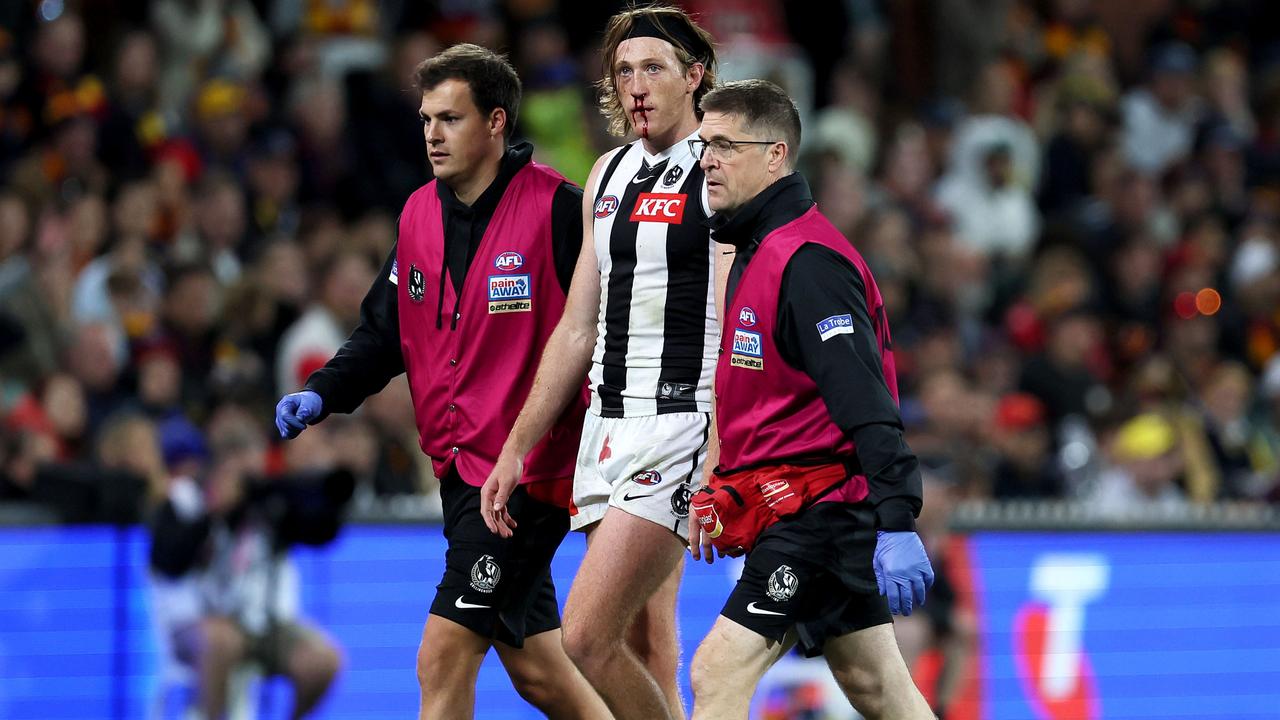 Nathan Murphy was helped from the field. Photo by James Elsby/AFL Photos via Getty Images.