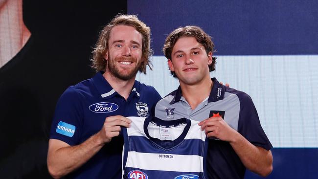 Guthrie presenting Jhye Clark with his Cats jumper at the 2022 draft. He believes he can be a key player for the Cats into the future. Picture: Getty Images