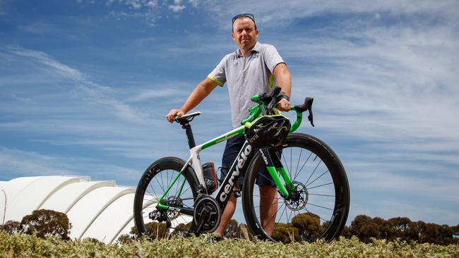 8/1/18 Australian Olympic cycling coach Tim Decker with his road bike outside the velodrome in Adelaide. Picture by Matt Turner.