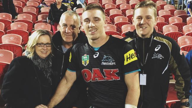 With his mother, father David, and brother after his NRL debut for Penrith.