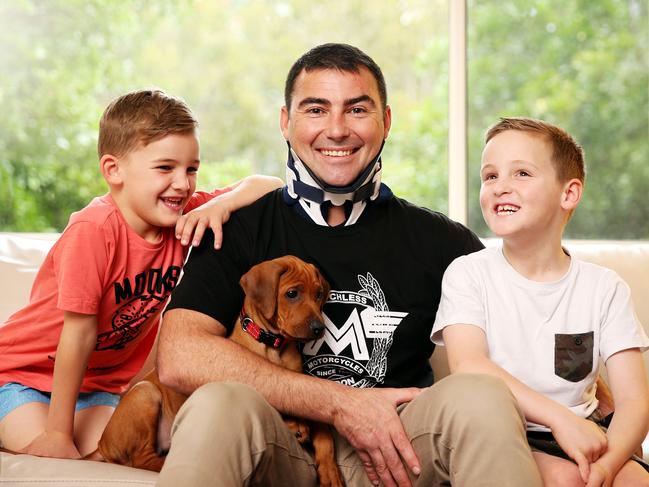 Brad Lewis with his sons Oscar, 8, and Connor, 6, and dog Marley. Brad is nominated for a Pride of Australia Medal. Picture: Tim Hunter