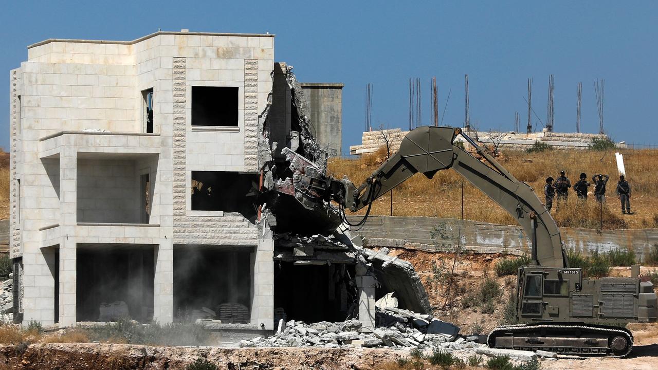 Israeli security forces tear down Palestinian buildings in the West Bank village of Dar Salah in 2019. Picture: AFP
