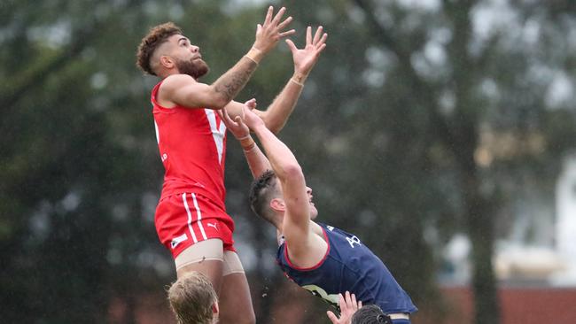 North Adelaide's Nigel Lockyer Jnr takes flight for his soaring mark against Norwood. Picture: Kurt Donsberg.