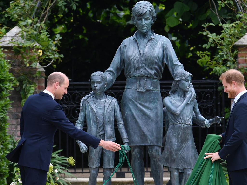 Prince William, Duke of Cambridge (left) and Prince Harry, Duke of Sussex unveil a statue they commissioned of their mother Diana, Princess of Wales, in the Sunken Garden at Kensington Palace, on what would have been her 60th birthday.