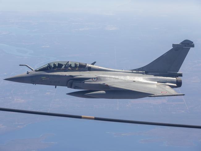 A French Rafale jet refuels mid-air about 100km south of Darwin. Picture: Floss Adams.