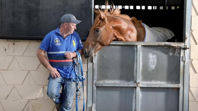 Trainer, Richard Jolly at his Morphettville stables, with Karlovasi. Picture: AAP Image/Dean Martin