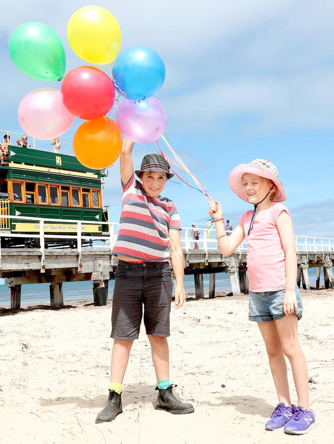 Lila and Oscar with balloons at Victor Harbor. Picture: Dylan Coker