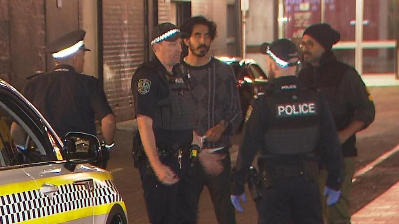 Dev Patel speaking to SA Police after the incident. Picture: 7NEWS