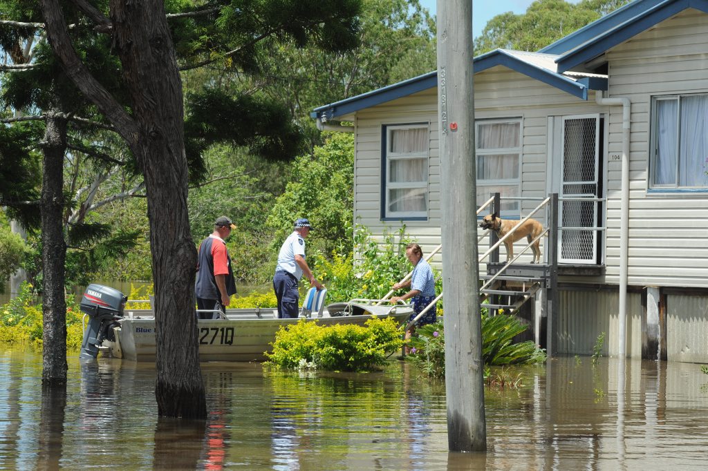 Senior constable Steve Power checks on the safety of some Tinana residents. . Picture: Robyne Cuerel