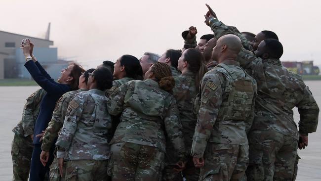 US Vice President Kamala Harris poses for a selfie with soldiers before her departure from Osan Air Base in Pyeongtaek. Picture: AFP