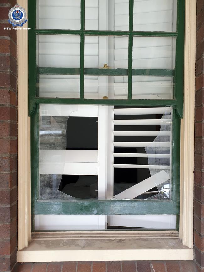 A smashed window at a short-stay property. Source: NSW Police,