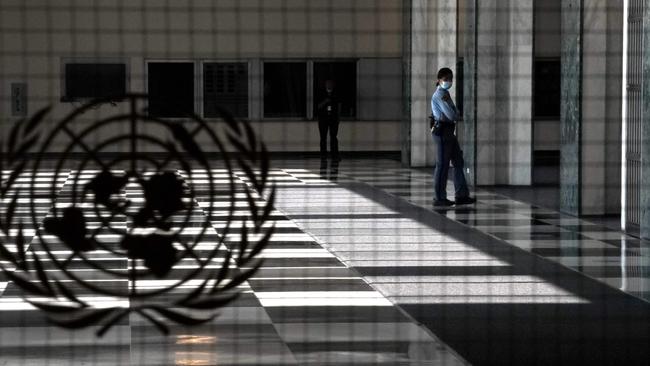 A UN police officer stands at an empty entrance at the United Nations during the 75th General Assembly of the United Nations which will be mostly virtual due to the COVID-19 pandemic. Picture: Timothy A Clary/AFP