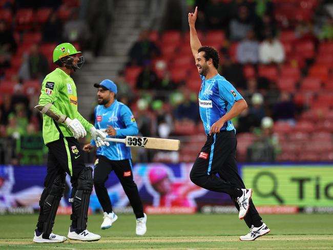 SYDNEY, AUSTRALIA - DECEMBER 16: Wes Agar of the Strikers celebrates dismissing Gurinder Sandhu of the Thunder during the Men's Big Bash League match between the Sydney Thunder and the Adelaide Strikers at Sydney Showground Stadium, on December 16, 2022, in Sydney, Australia. (Photo by Cameron Spencer/Getty Images)