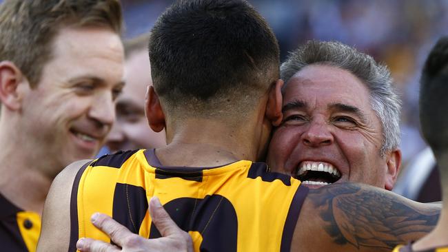 Fagan hugs Bradley Hill after the 2014 AFL Grand Final. Picture: Wayne Ludbey