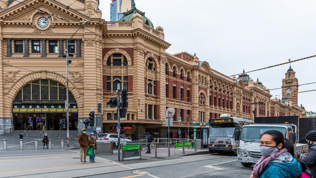 Pedestrians wearing masks outside Flinders Street station in Melbourne on September 25. Picture: Asanka Ratnayake/Getty