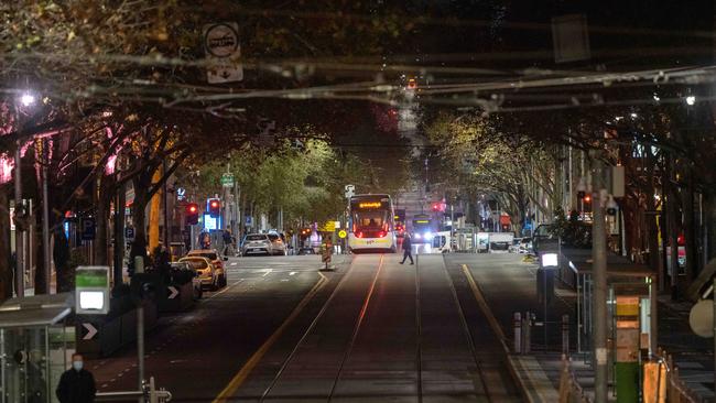 Melbourne’s locked down CBD on Friday night. Picture: Tony Gough