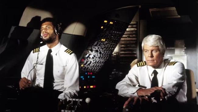 Co-pilot Roger Murdock (Kareem Abdul-Jabbar) and Captain Clarence Oveur (Peter Graves).