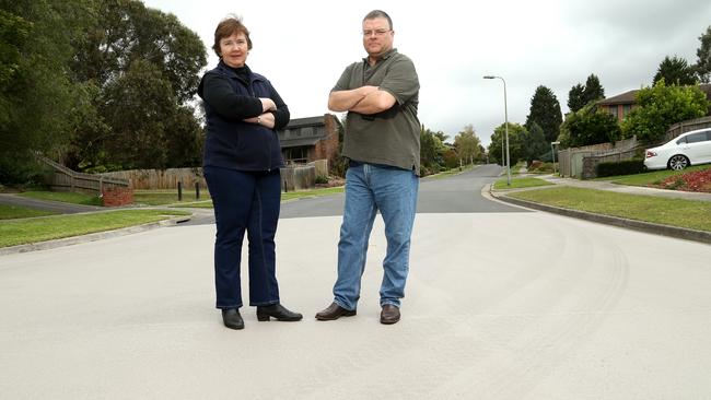 Leanne White (left) and Clarke Stevenson are unhappy with the white resurfacing of Deep Creek Drive Picture: Hamish Blair