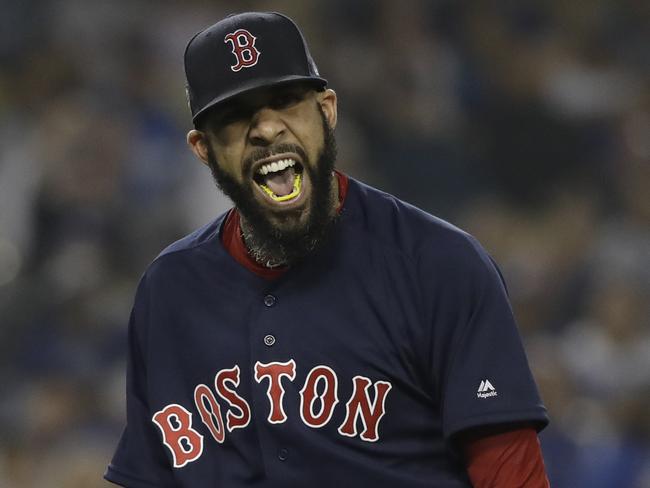 Boston Red Sox pitcher Rick Porcello celebrates the end of the seventh inning in Game 5 of the World Series baseball game against the Los Angeles Dodgers on Sunday, Oct. 28, 2018, in Los Angeles. (AP Photo/David J. Phillip)