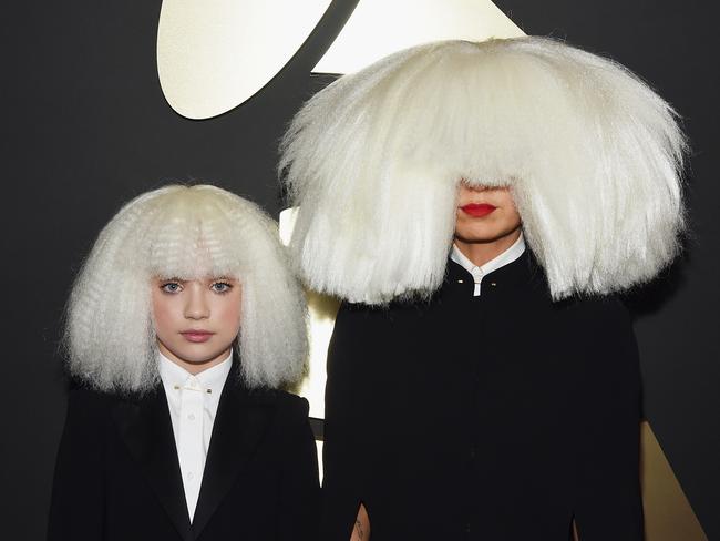 Sia and dancer Maddie Ziegler wearing matching white wigs at the Grammys.